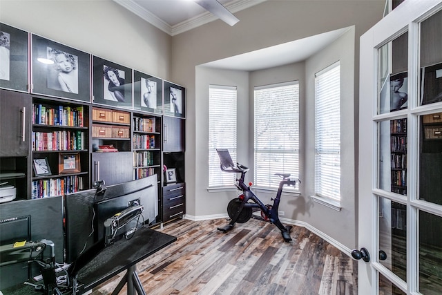 home office featuring baseboards, wood finished floors, and crown molding