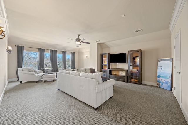 living room featuring baseboards, visible vents, carpet floors, and ceiling fan