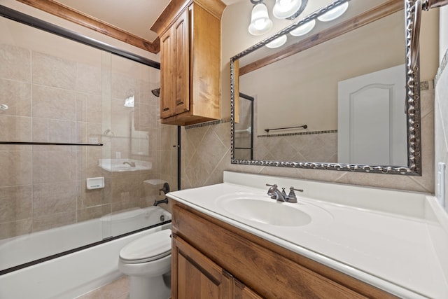 bathroom featuring vanity, enclosed tub / shower combo, tile walls, toilet, and tile patterned floors