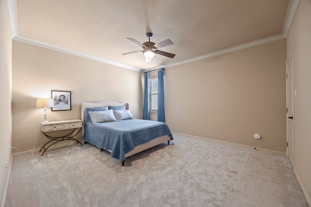 bedroom with ceiling fan, baseboards, crown molding, and carpet