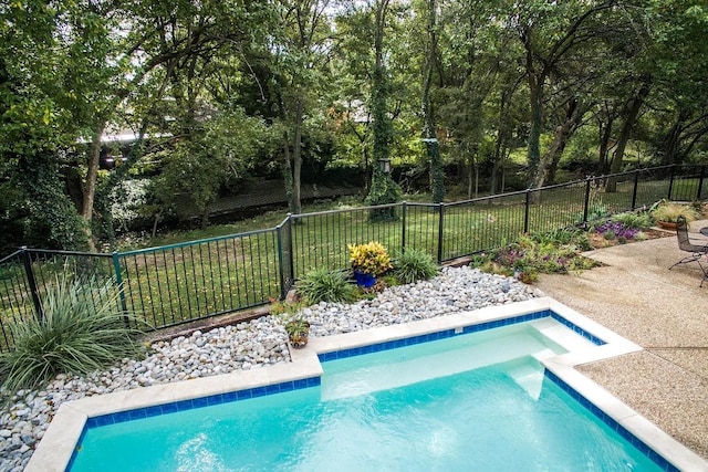 view of swimming pool featuring fence and a fenced in pool