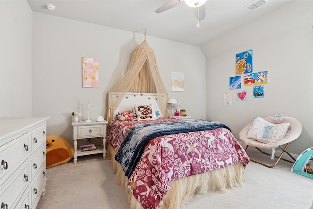 bedroom with vaulted ceiling, light colored carpet, ceiling fan, and visible vents