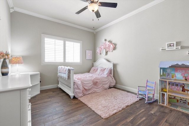 bedroom featuring baseboards, a ceiling fan, wood finished floors, and crown molding