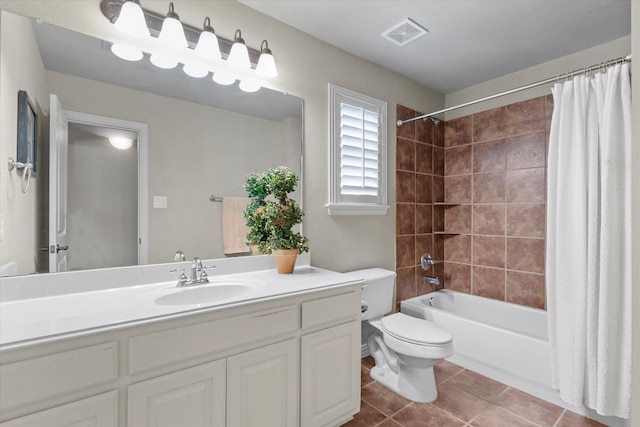 full bathroom with visible vents, toilet, shower / tub combo, tile patterned floors, and vanity