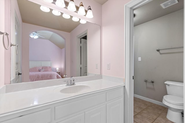 bathroom featuring visible vents, toilet, connected bathroom, tile patterned flooring, and ceiling fan