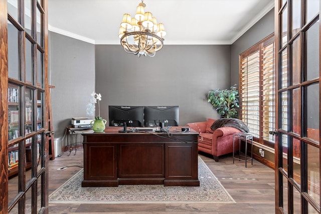 office with wood finished floors, a healthy amount of sunlight, and ornamental molding