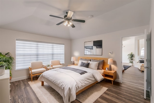 bedroom featuring lofted ceiling, ceiling fan, baseboards, and dark wood-type flooring