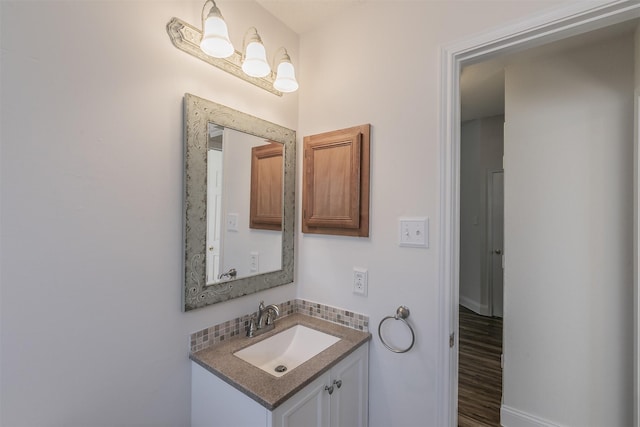 bathroom with backsplash and vanity