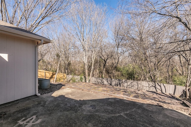 view of yard featuring a patio area and a fenced backyard