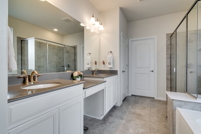 bathroom with a stall shower, tile patterned flooring, visible vents, and vanity