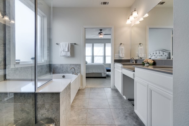 bathroom with visible vents, connected bathroom, a garden tub, tile patterned flooring, and vanity