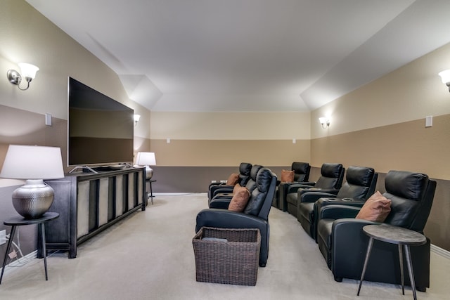 cinema room featuring light carpet