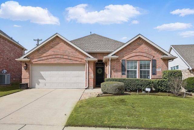 single story home with a garage, driveway, and brick siding