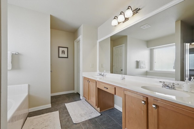 full bathroom featuring a garden tub, double vanity, a sink, and visible vents