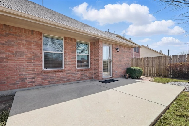 view of patio / terrace featuring fence