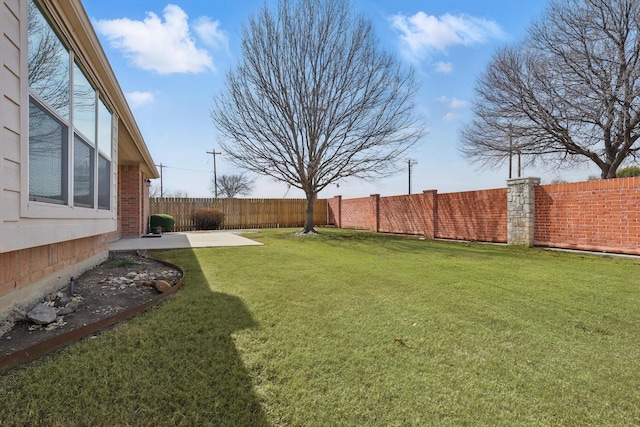 view of yard featuring a fenced backyard and a patio