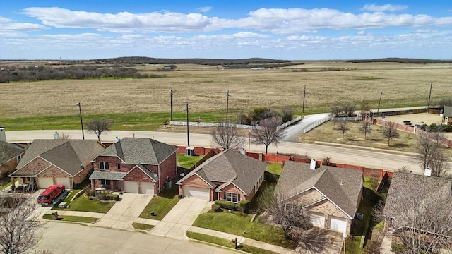 aerial view featuring a residential view and a rural view