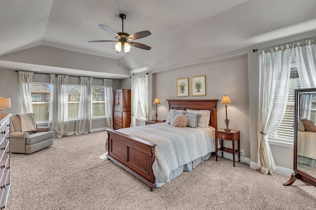 bedroom with light carpet, ceiling fan, vaulted ceiling, and baseboards