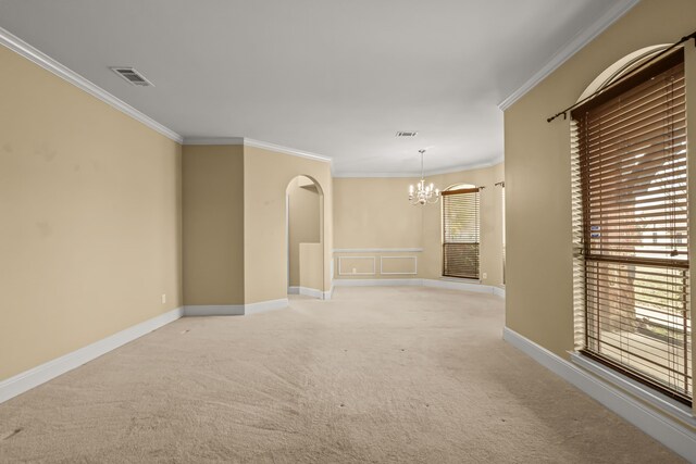 3054 Oakwood Dr, Celina, TX 75009 - empty room with visible vents, an inviting chandelier, crown molding, and light carpet