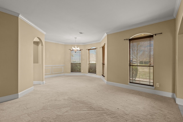3054 Oakwood Dr, Celina, TX 75009 - spare room featuring visible vents, ornamental molding, a wealth of natural light, an inviting chandelier, and light colored carpet