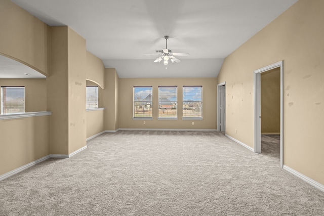 3054 Oakwood Dr, Celina, TX 75009 - carpeted empty room with arched walkways, baseboards, vaulted ceiling, and ceiling fan