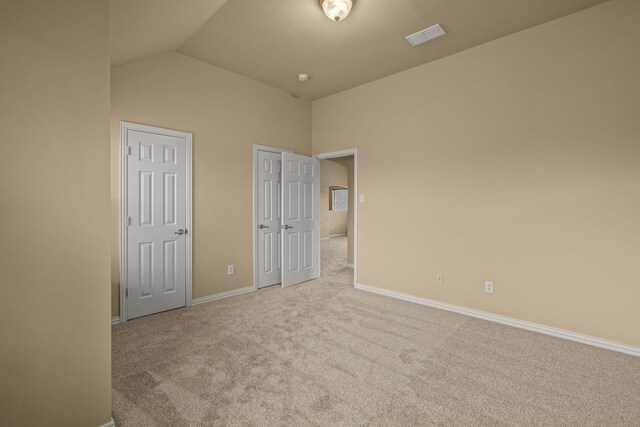 3054 Oakwood Dr, Celina, TX 75009 - unfurnished bedroom featuring baseboards, carpet flooring, visible vents, and vaulted ceiling