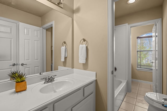 3054 Oakwood Dr, Celina, TX 75009 - bathroom featuring baseboards, toilet, tile patterned floors, and vanity