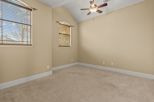 3054 Oakwood Dr, Celina, TX 75009 - spare room with lofted ceiling, a healthy amount of sunlight, a ceiling fan, and light carpet