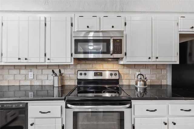 kitchen featuring white cabinets, dark countertops, and stainless steel appliances