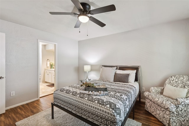 bedroom with baseboards, wood finished floors, ensuite bathroom, and a ceiling fan