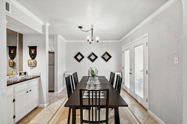 dining room with baseboards, visible vents, crown molding, and light tile patterned floors