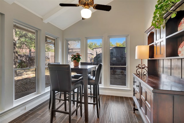 dining room featuring lofted ceiling with beams and dark wood-type flooring