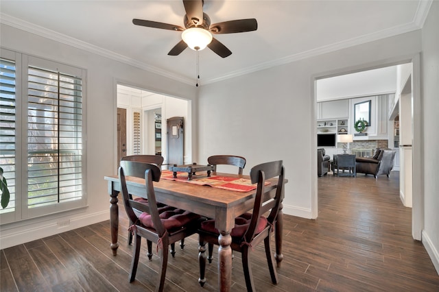 dining space featuring ornamental molding and dark wood finished floors