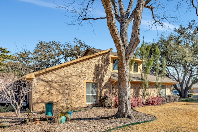 view of home's exterior featuring brick siding