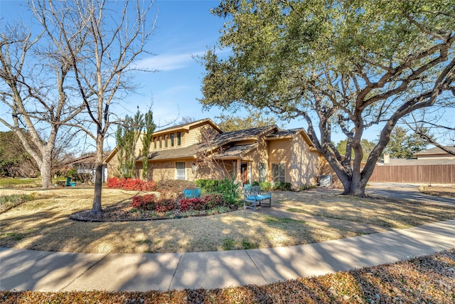 view of front of house with fence