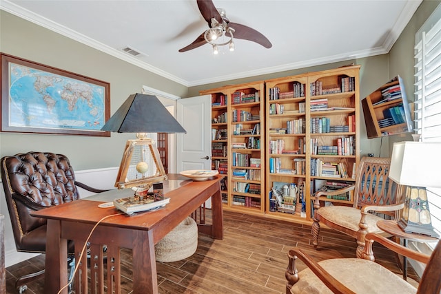 home office featuring crown molding, ceiling fan, visible vents, and wood tiled floor