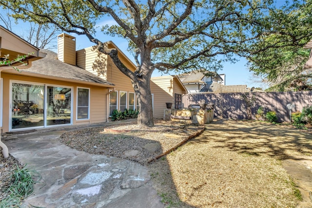 view of yard featuring a patio area and fence