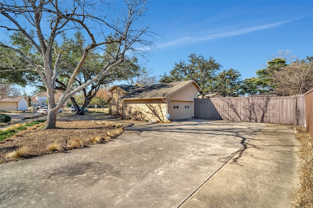 view of home's exterior with fence