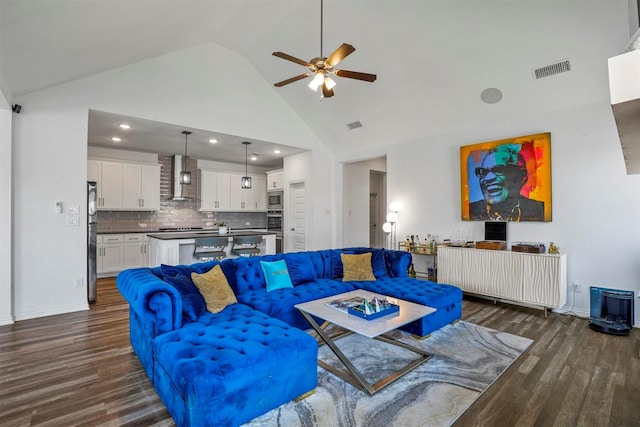 living area with high vaulted ceiling, ceiling fan, visible vents, and dark wood-style flooring