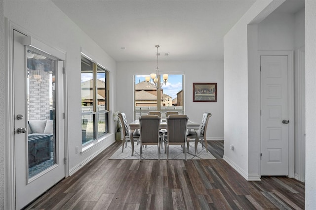 dining space with an inviting chandelier, baseboards, visible vents, and dark wood-style flooring