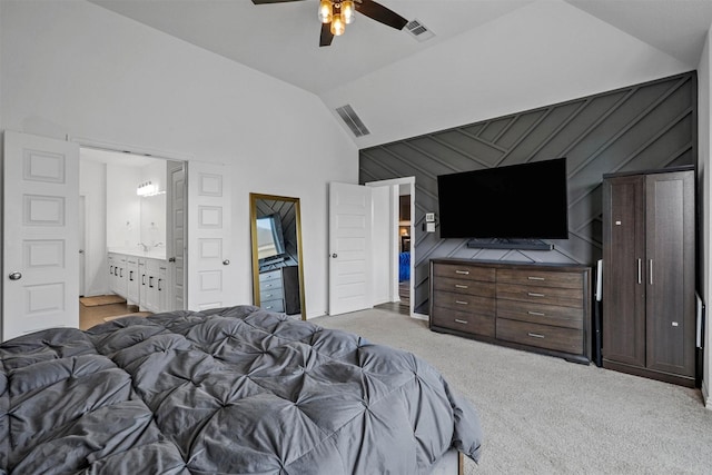 bedroom with lofted ceiling, ceiling fan, light carpet, and visible vents