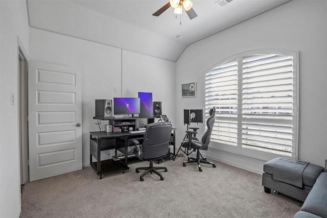 home office with carpet, ceiling fan, lofted ceiling, and baseboards