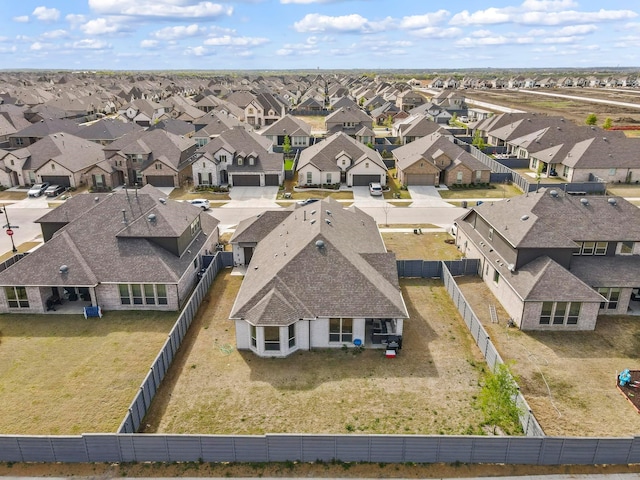 birds eye view of property with a residential view