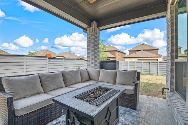 view of patio with an outdoor living space with a fire pit and a fenced backyard