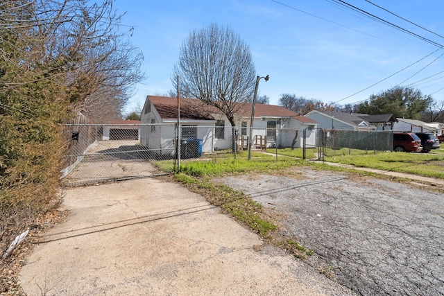 view of front of home featuring fence private yard and a gate