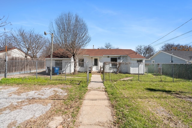 6518 Meade St, Dallas, TX 75232 - view of front facade with a fenced front yard, a gate, a front lawn, and stucco siding