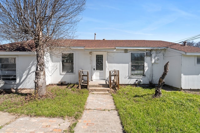 6518 Meade St, Dallas, TX 75232 - view of front of house with a shingled roof and a front lawn