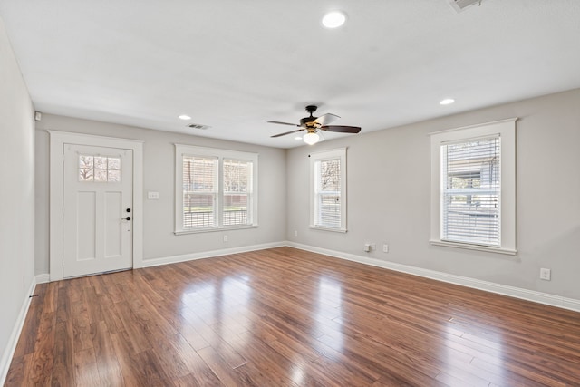 foyer entrance with recessed lighting, baseboards, and wood finished floors