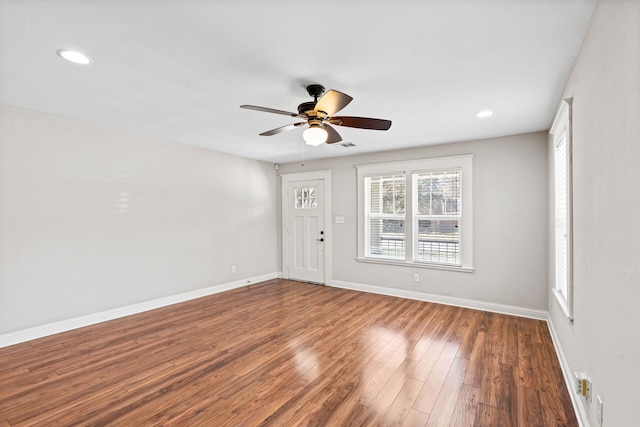 interior space featuring recessed lighting, visible vents, baseboards, and wood finished floors