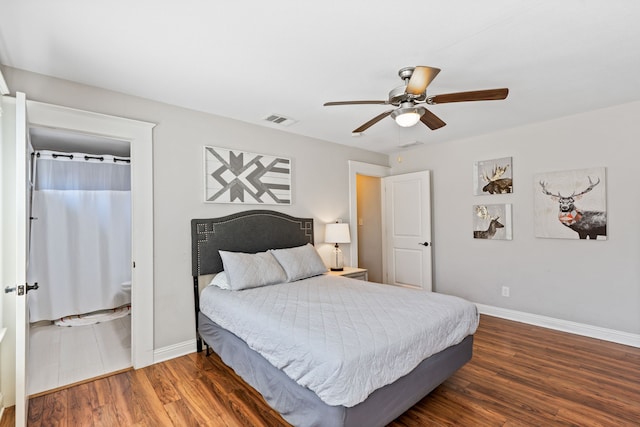 bedroom with a ceiling fan, wood finished floors, visible vents, and baseboards